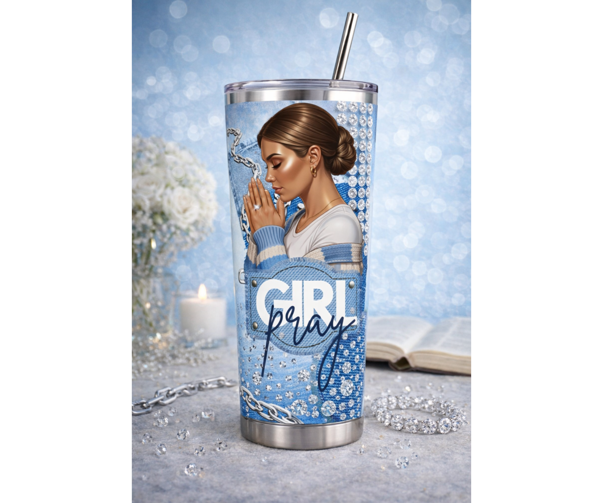 Tumbler with a design of a woman with Low Bun hairstyle  praying, surrounded by decorative elements on a light blue background.