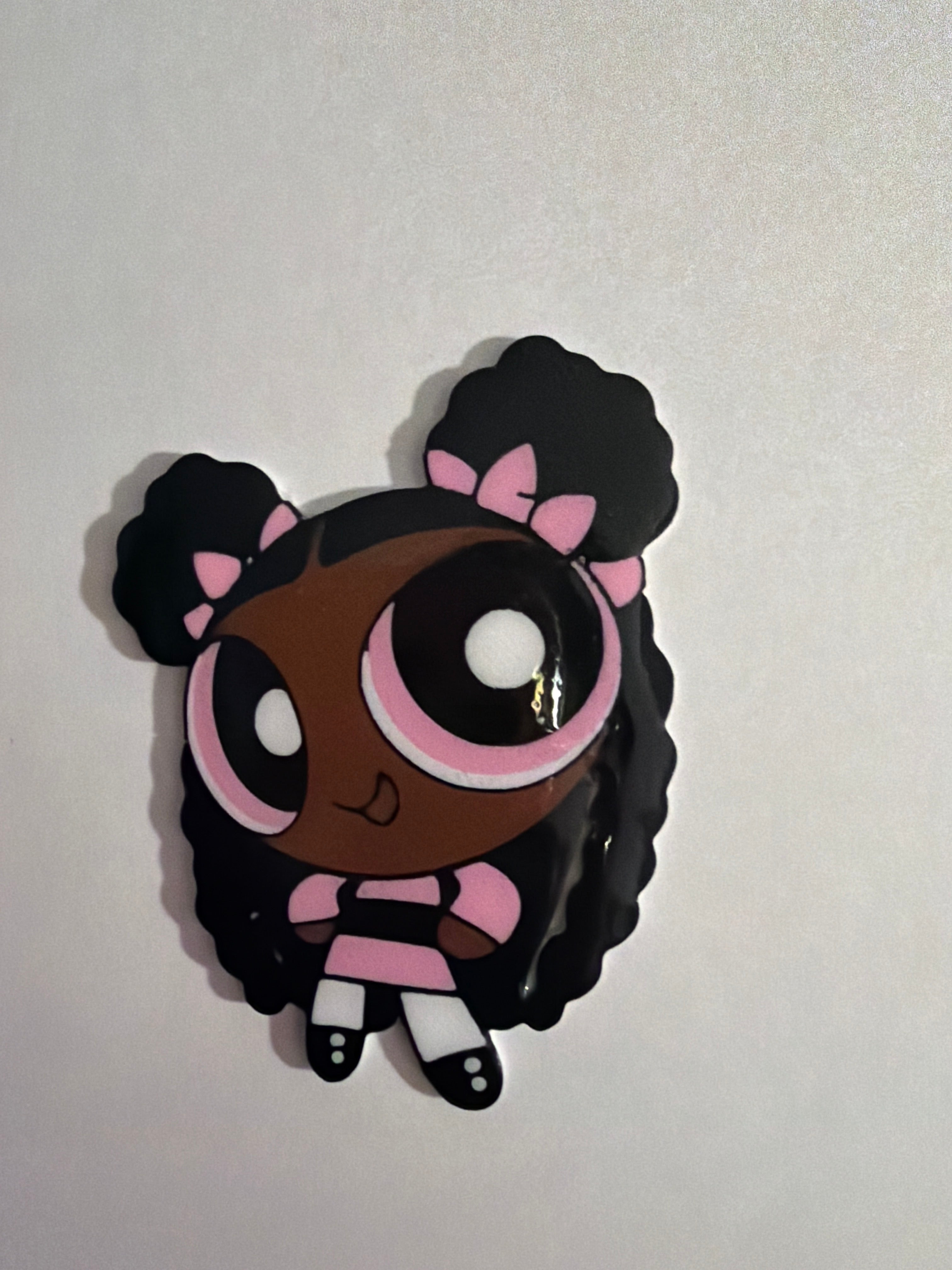 Cartoonish character with black hair, pink bows, and a white background