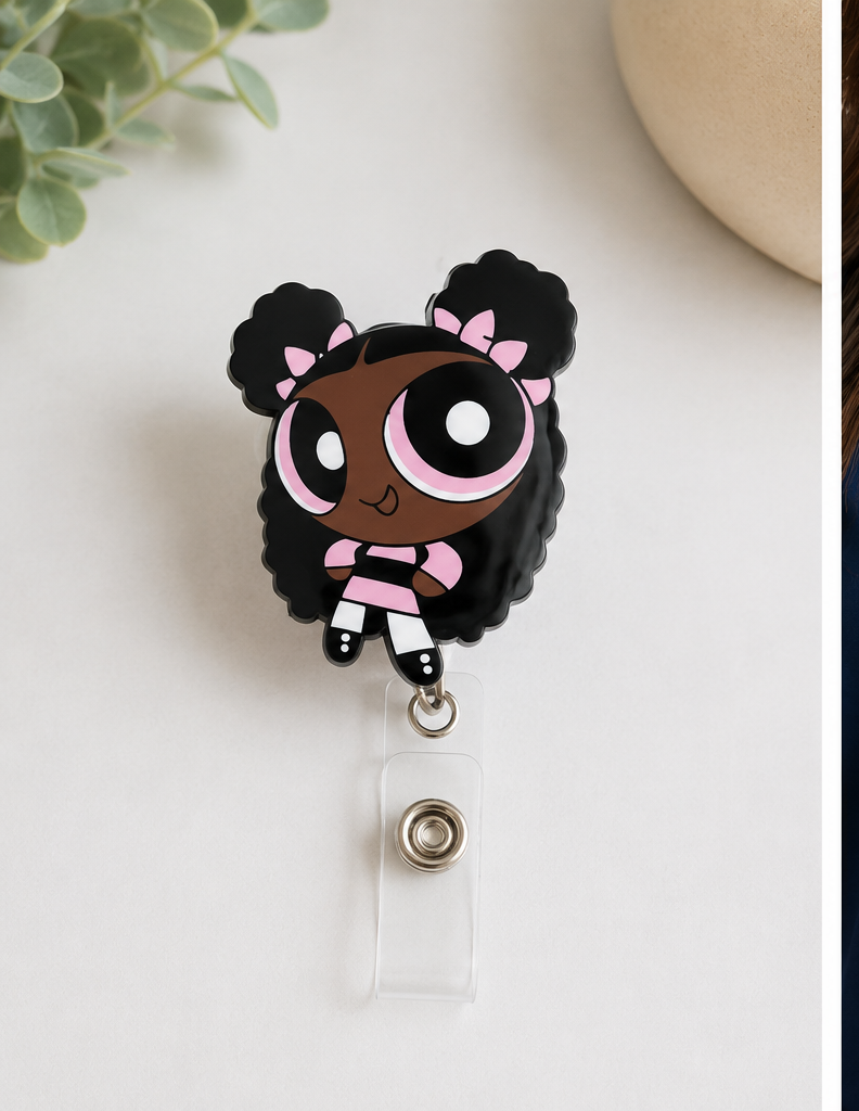 Cartoon character badge holder on a white background and worn on a person's scrub top.