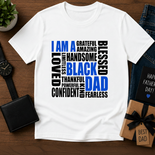 White t-shirt with motivational text design on a wooden surface with accessories.