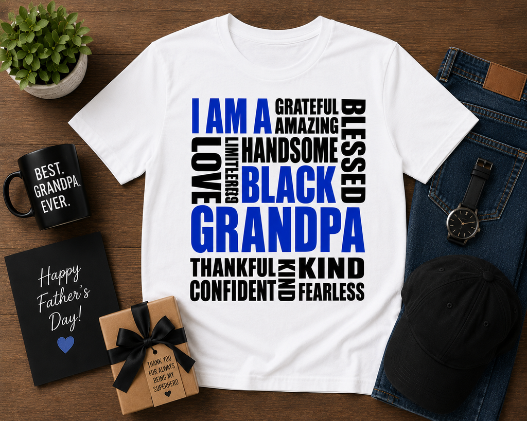 White t-shirt with motivational text on a wooden surface with Father's Day items.