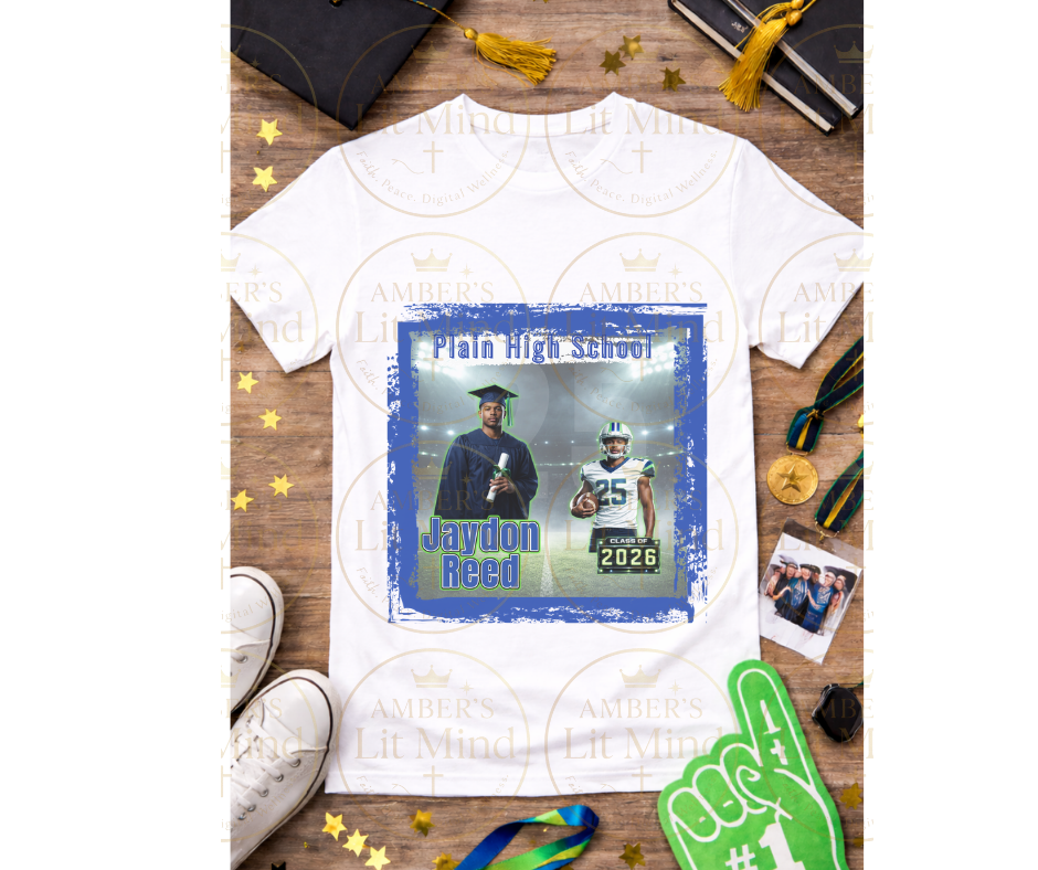 Graduation-themed t-shirt with personalized design on a wooden surface with graduation accessories.